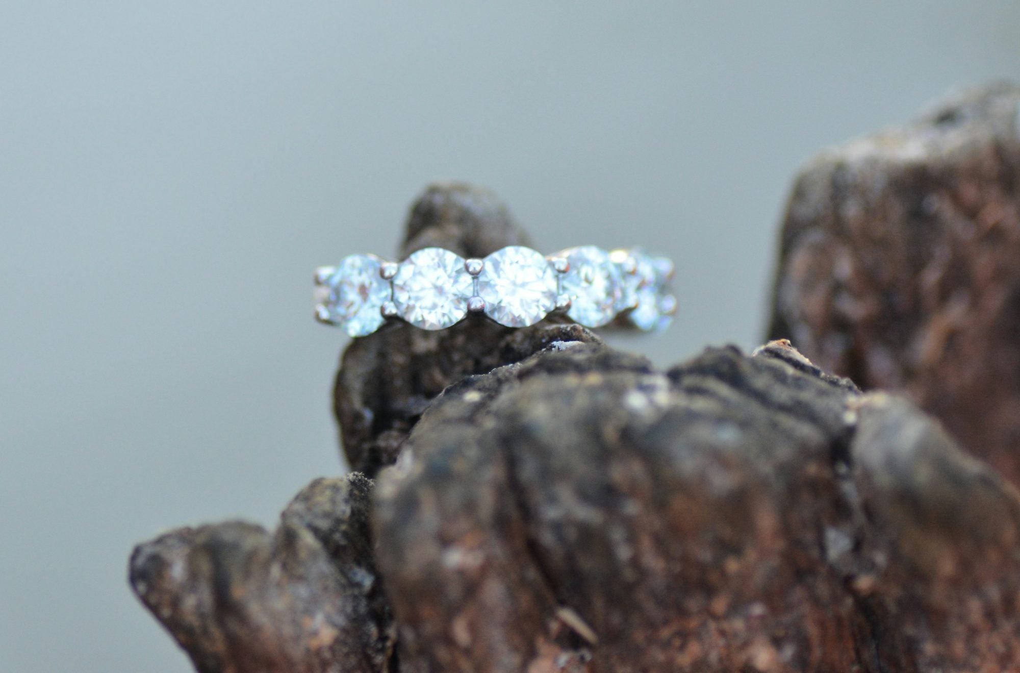 The Vintage Cushion — cushion cut lab-grown diamond ring on weathered wood